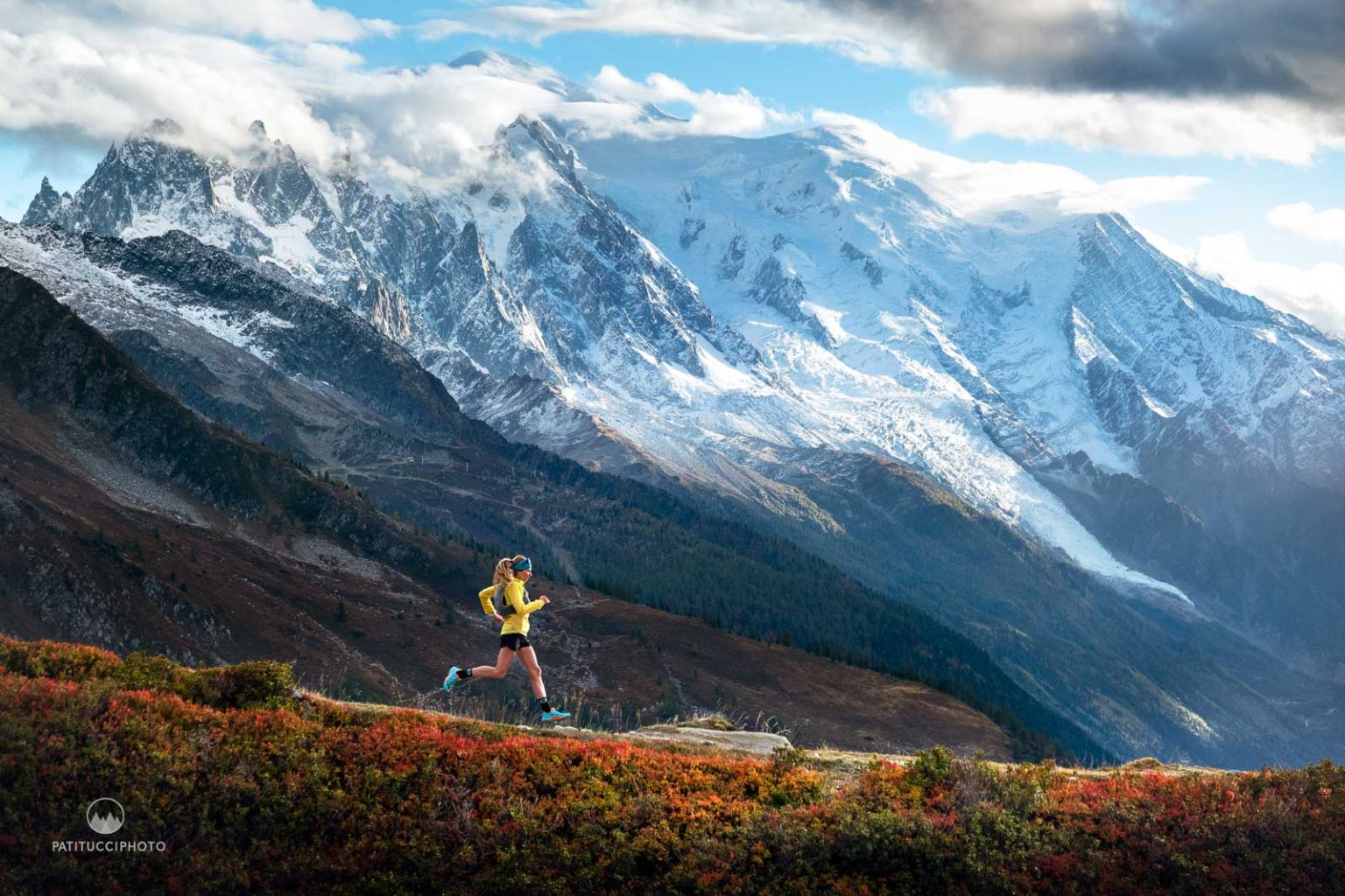 Trail runner in the mountains representing the journey to financial freedom